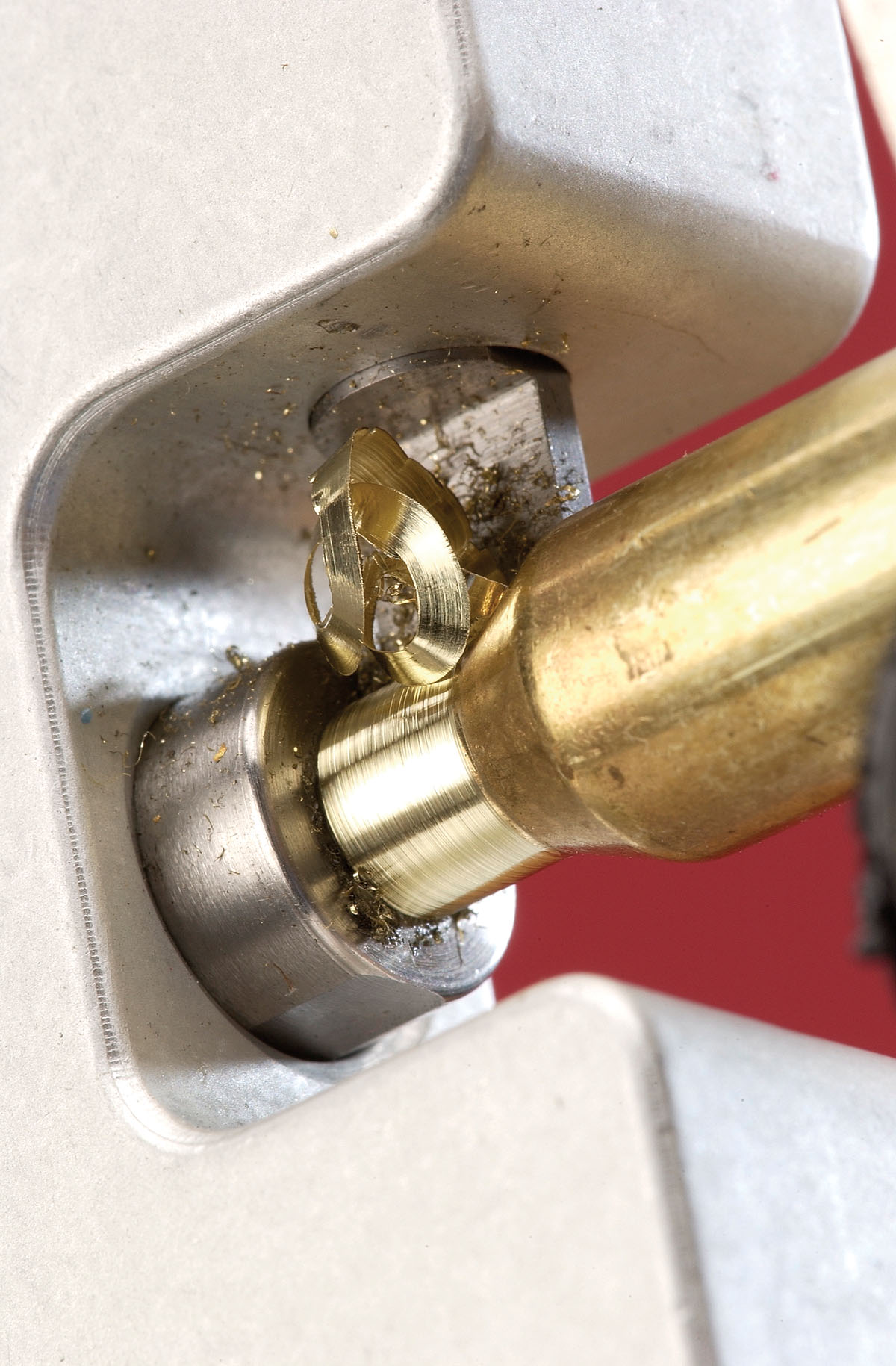 When neck turning, try to obtain a twirl to the metal coming off the case, like peeling an apple. The more uniform it is, the more precise the cut.