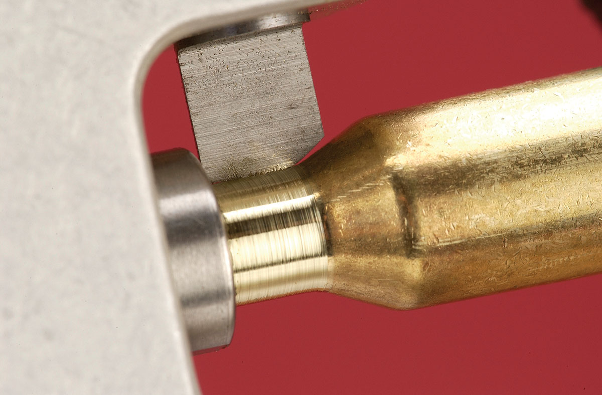 On any good neck turning tool, make sure the shoulder of the case is not  cut or nicked by the cutter blade. Notice the clearance between the blade and the case shoulder.