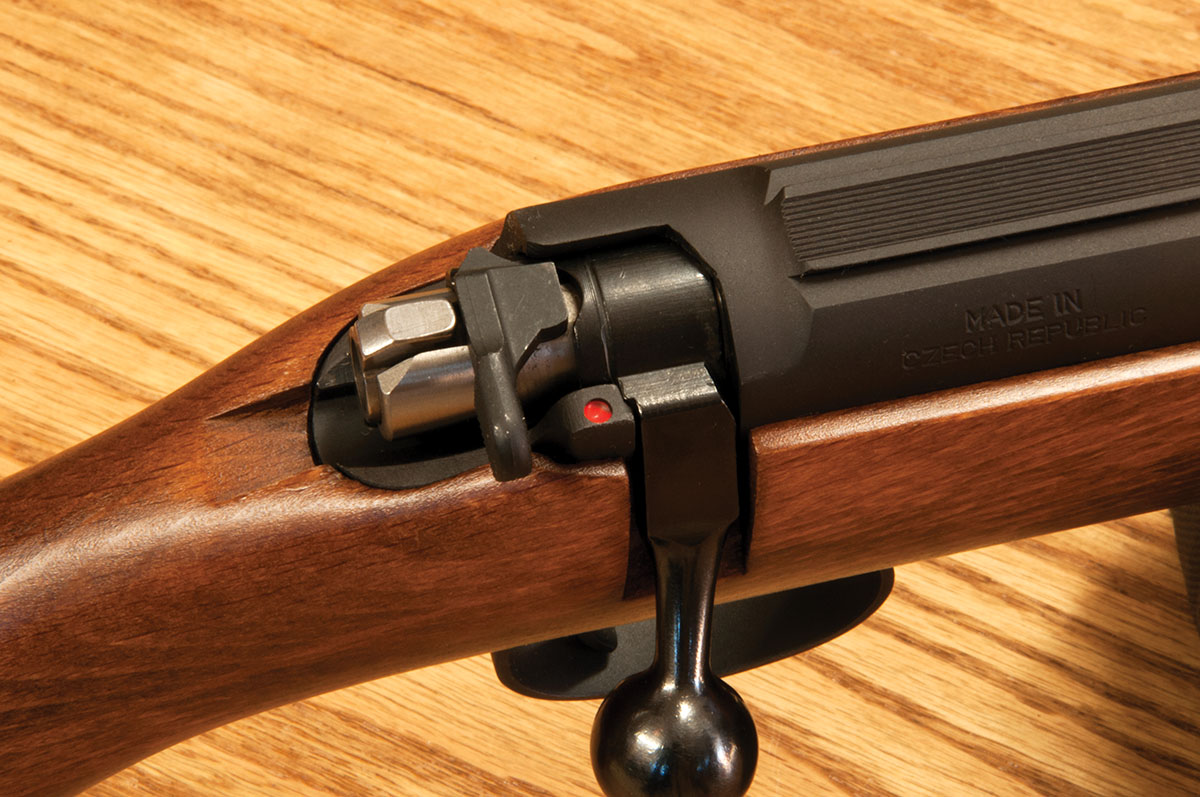 Older CZ rifles like this Model 452 Scout 22 Long Rifle featured a safety lever located on the bolt, which required a shooter to pull the lever back to fire. Newer Models feature a traditional two-position sliding safety on the receiver’s side.