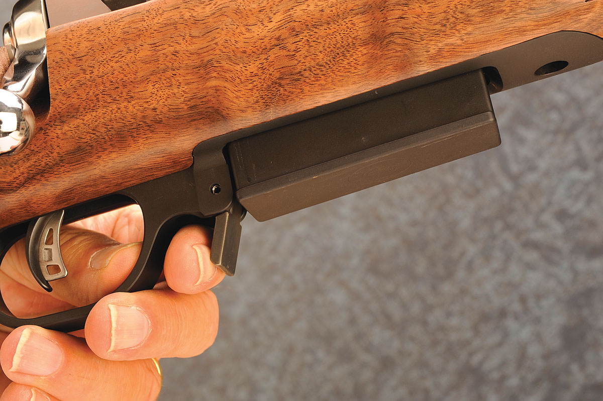 With an extended lever in front of the trigger guard, one small push forward drops the magazine into your hand.