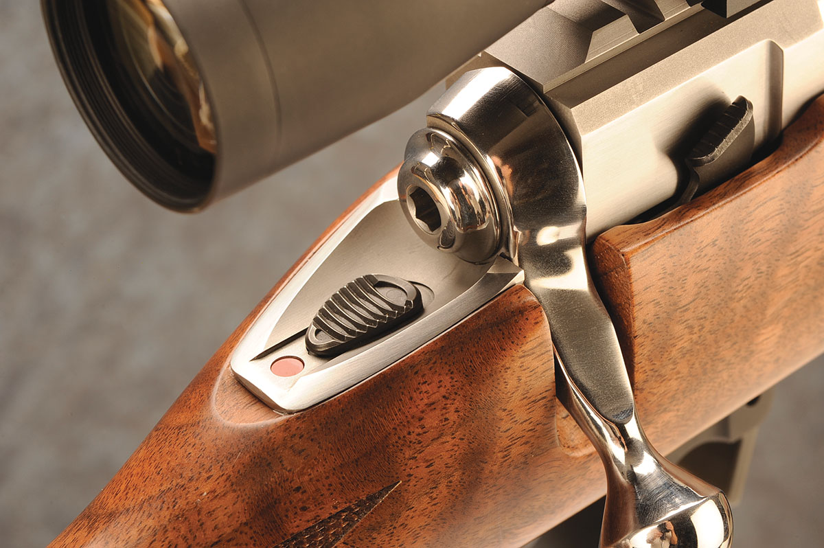 The safety lever is tang-mounted for right- and left-hand use. All the way back is the full-lock position; midposition allows the action to be opened while the sear is blocked; the forward position allows the rifle to be fired.