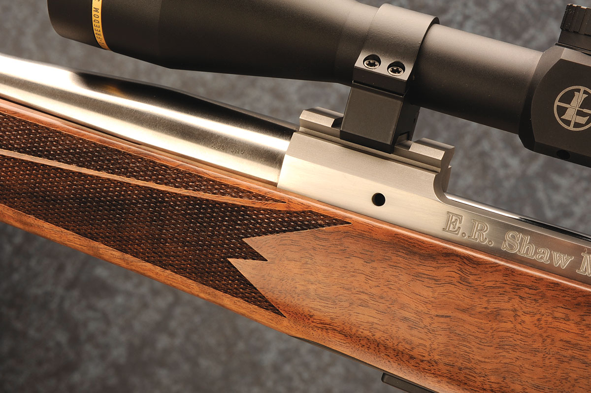 Gas-escape ports are located on both sides of the receiver.