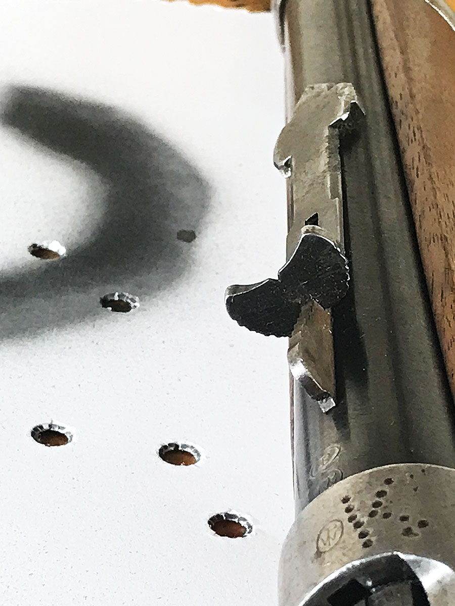 This Winchester Model 1894 features a standard rear sight. Moving the rear sight one step on the elevator moved bullet impact three inches at 50 yards.