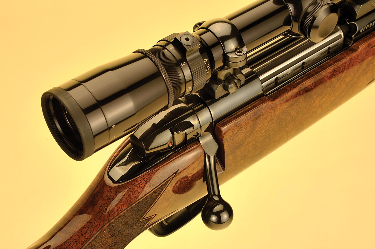 This high angle shows the two-position safety lever located behind the bolt handle, fluted bolt body and smaller six-locking lug action. A fine line around the checking pattern is a new addition to the stock design.