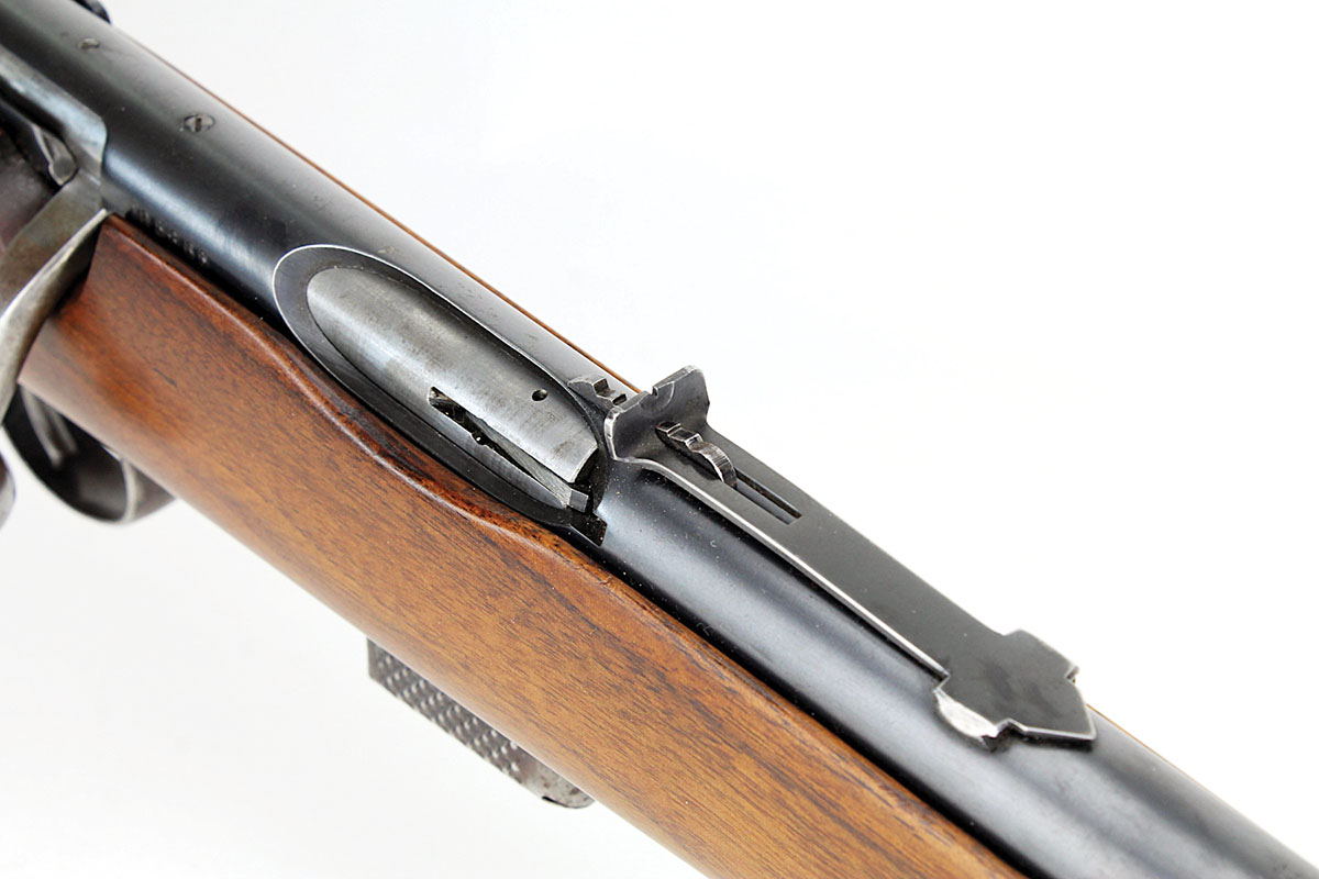Like some other Savage rifles, the 23B featured an oval ejection port, rather than an open-top receiver. The rear sight has a typical tiny notch and elevation slide.