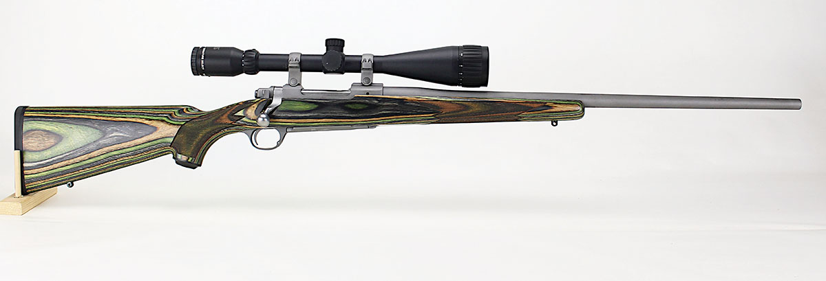 The Hawkeye’s green and blonde laminate stock makes the rifle’s heft about that of the M1 Garand.