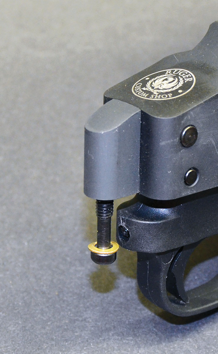 Free-floating the heavy barrel of the 10/22 Competition required the addition of an aluminum bedding block at the rear of the receiver. A bolt (shown here in the bedding block) reaches through the stock and screws into the bedding block. Adding the second bolt allows both ends of the receiver to be pulled firmly into the stock.