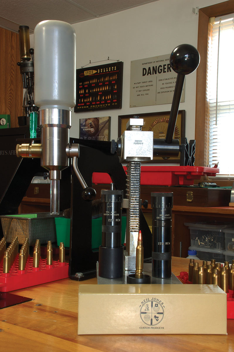A Neil Jones Custom Products arbor press, a .223 Remington neck-sizing, bump-bushing-type hand die and straight-line seater die and powder dispenser make easy work of load development.