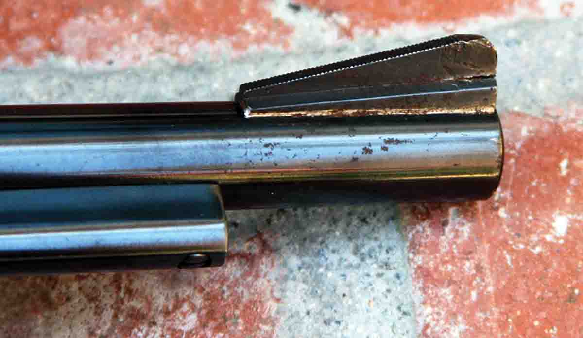 The damaged front sight blade on the 6-inch gun was irritating but did not affect performance.