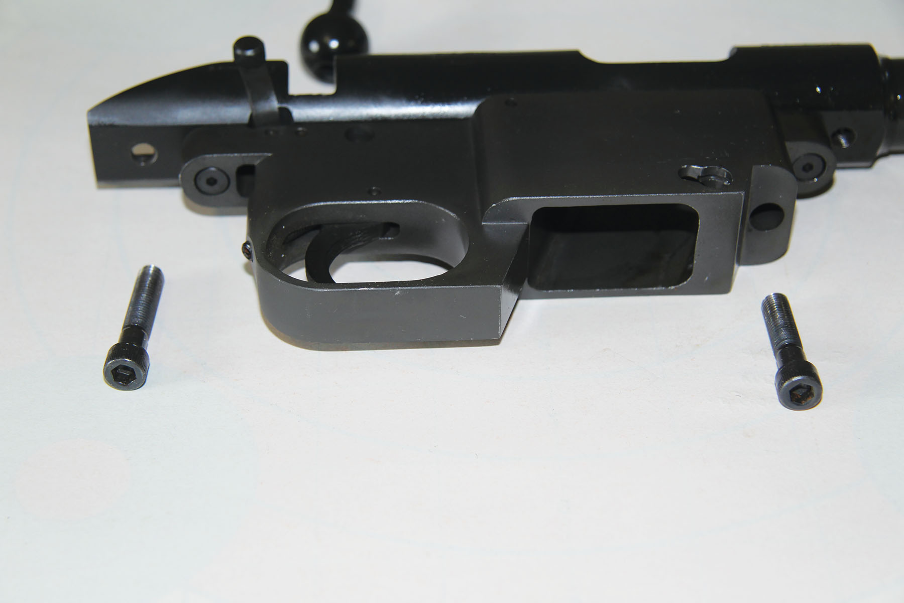 The action of the Armscor 22M TCM BA rifle is anchored into the hardwood stock by two robust bolts that include hex heads to prevent stripping.