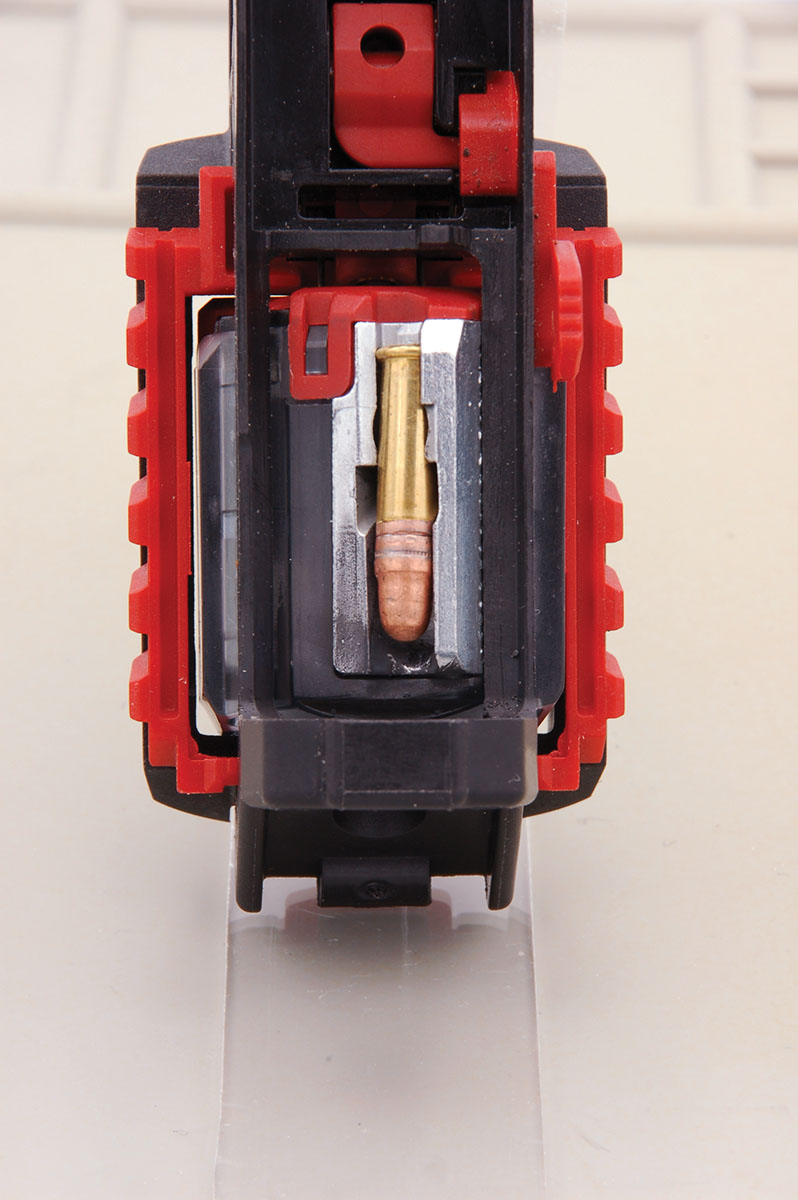 The lower receiver magazine well highlights the ambidextrous, red-ribbed left- and right-hand magazine release sliders.