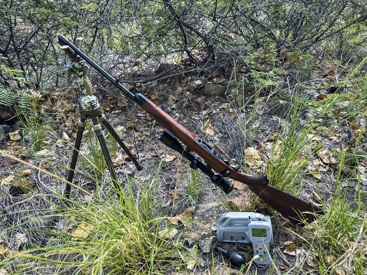 A good varmint hunter’s setup, complete with rifle, shooting sticks and callers.