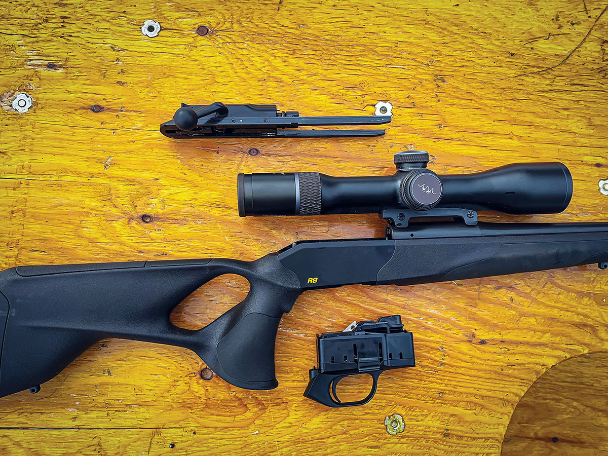 Shown are (top to bottom): the bolt assembly, Blaser R8 action and magazine/trigger group assembly.