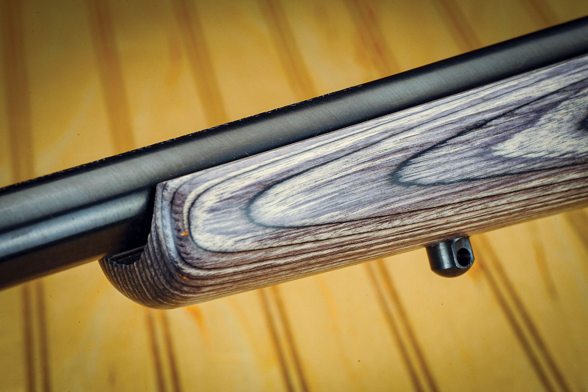 Like a typical hunting rifle, the barrel is free-floated right up to the receiver. The finish is deep blue. Sling swivel studs, both front and rear, come with the gun.