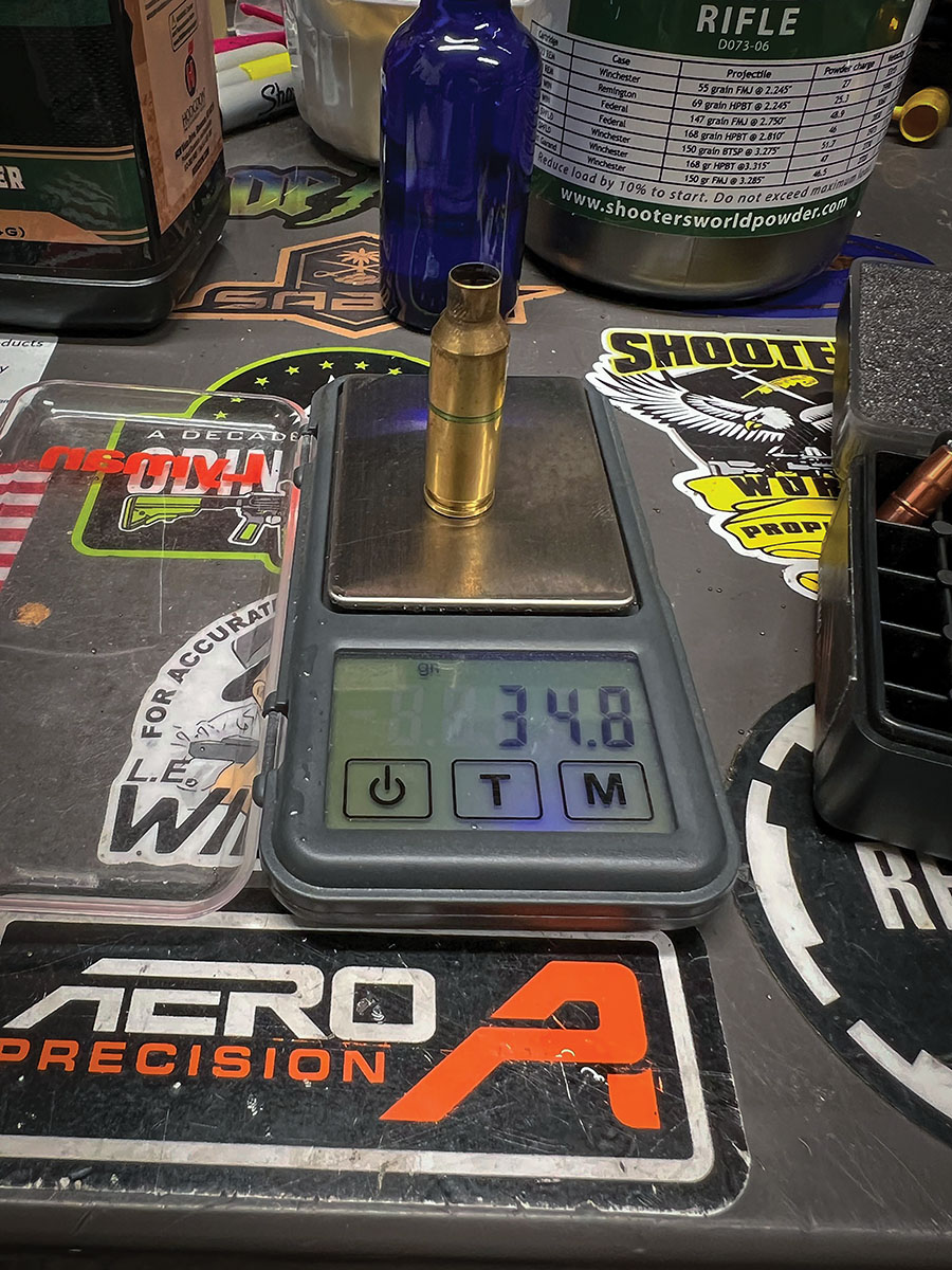 Twice-fired Hornady brass showing case capacity with water of 34.8 grains.